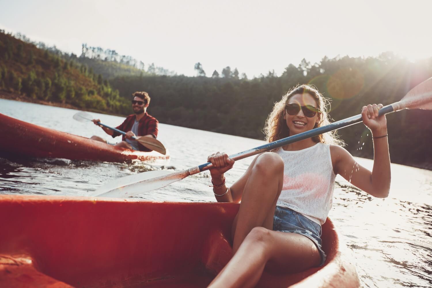 woman kayaking on lake