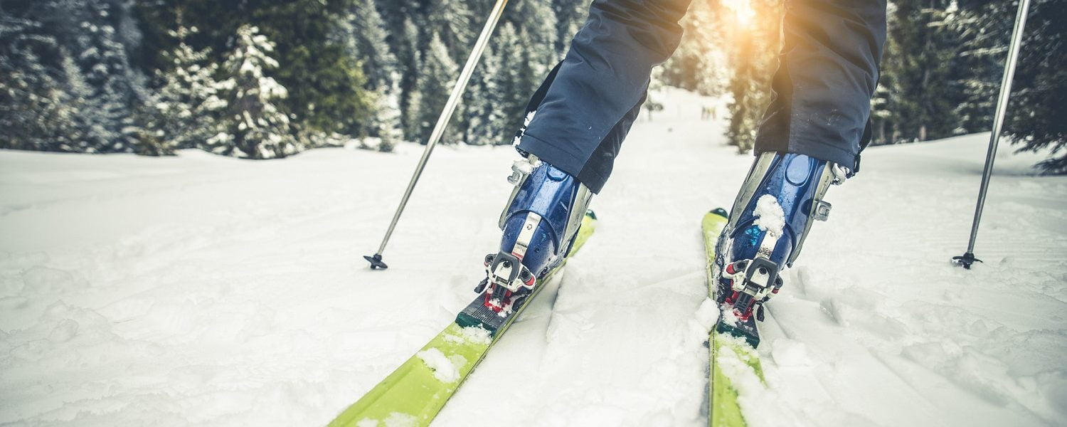 close up of person skiing on an alpine mountain