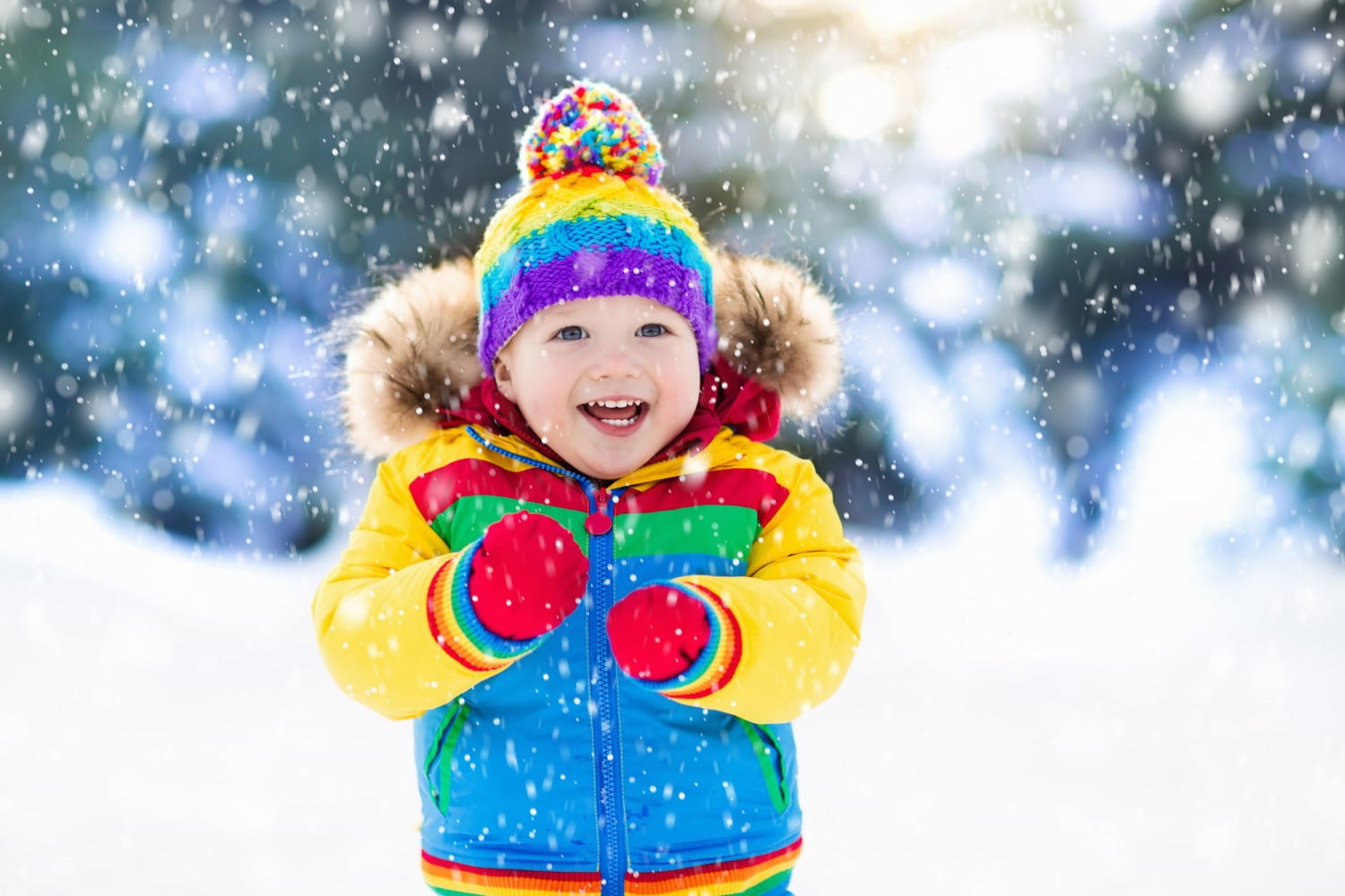 child playing in the snow