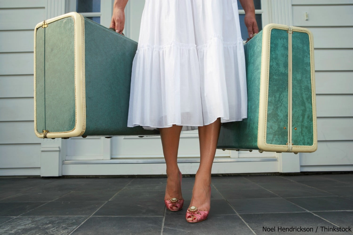 woman holding suitcases